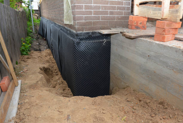 SJ Waterproofing Pros technician performing targeted Wet Basement Repair assessment in Joelton, TN